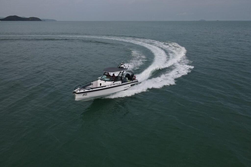 2023 Axopar 28 T-Top boat cruising on open water