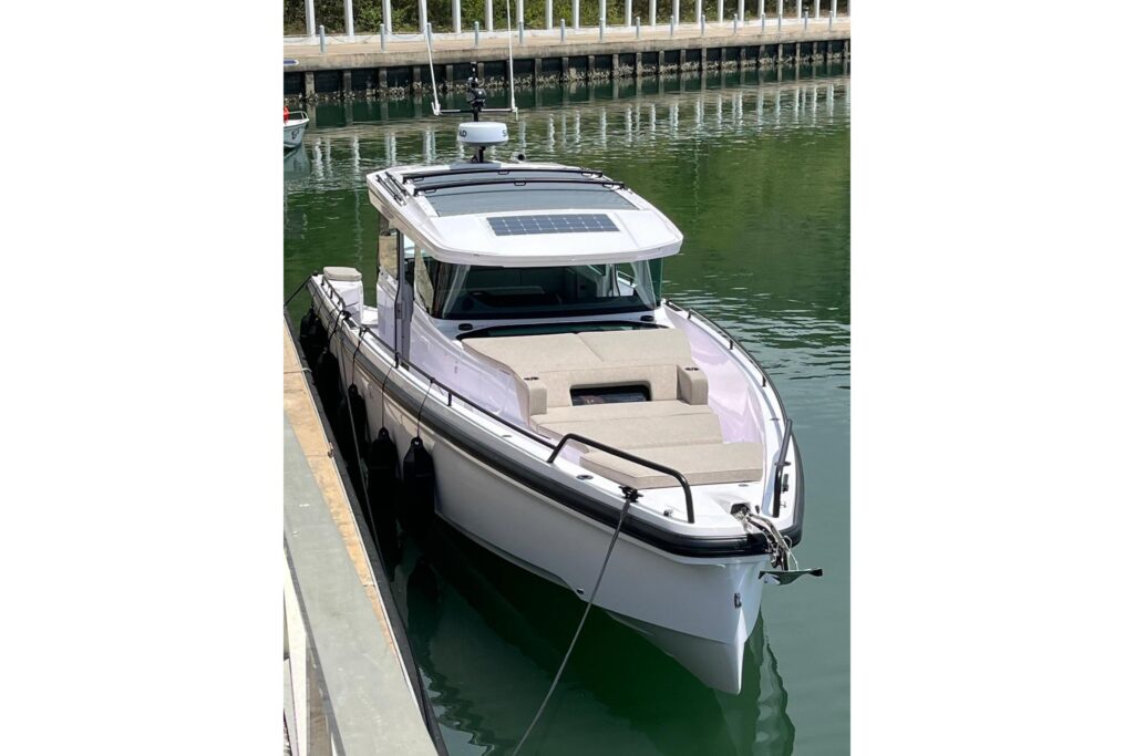 2025 Axopar 37 XC Cross Cabin boat docked in calm waters.