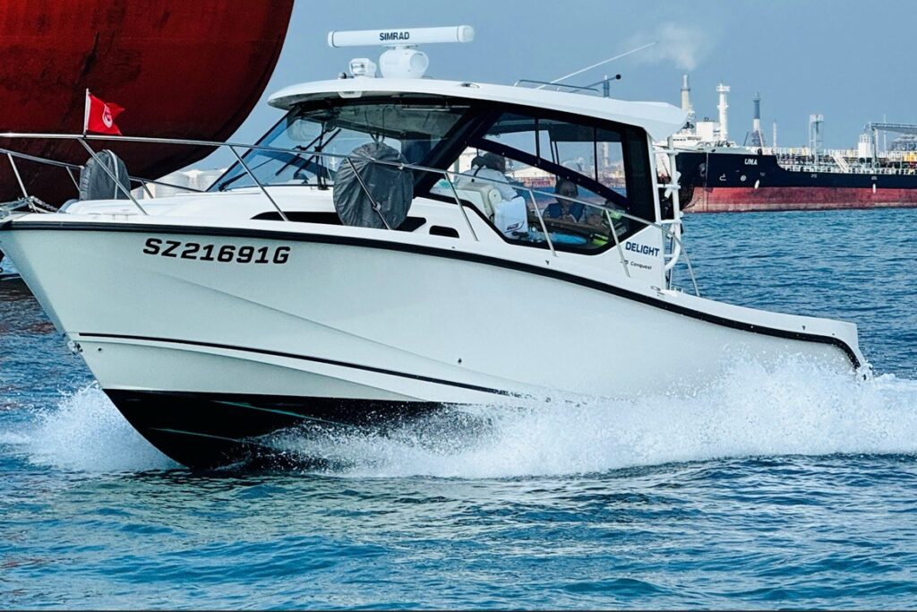 2023 Boston Whaler 325 Conquest cruising on open water